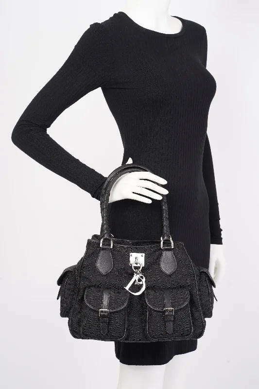 Christian Dior Saddle bags with a studded trim for a bold lookChristian Dior Trotter Black Oblique Canvas