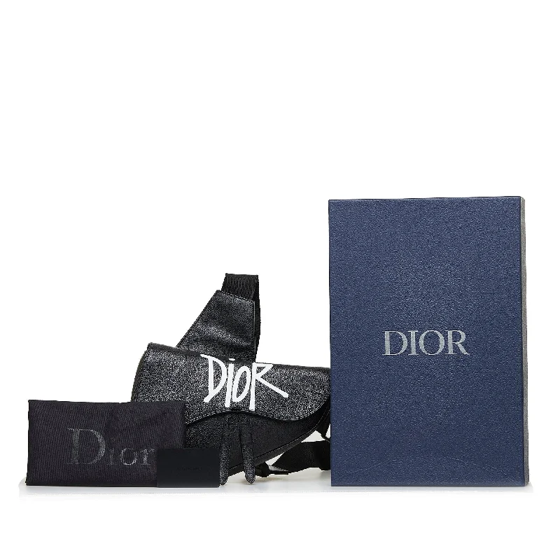 Christian Dior tote bags with a printed Dior logo on the frontDior X Stussy Saddle Bag Black Calfskin Limited Edition